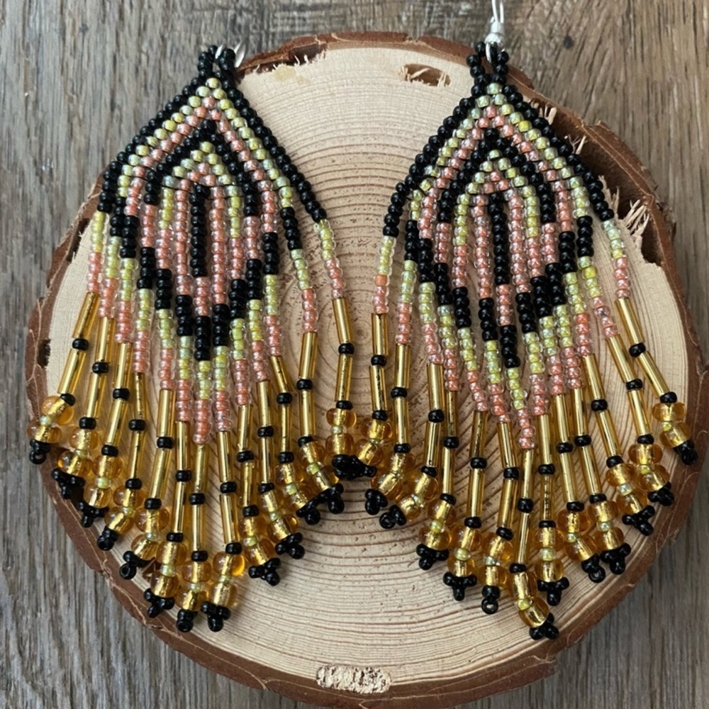Vibrant handmade chakira bead earrings. Made by artisans in Mexico. 3" Length